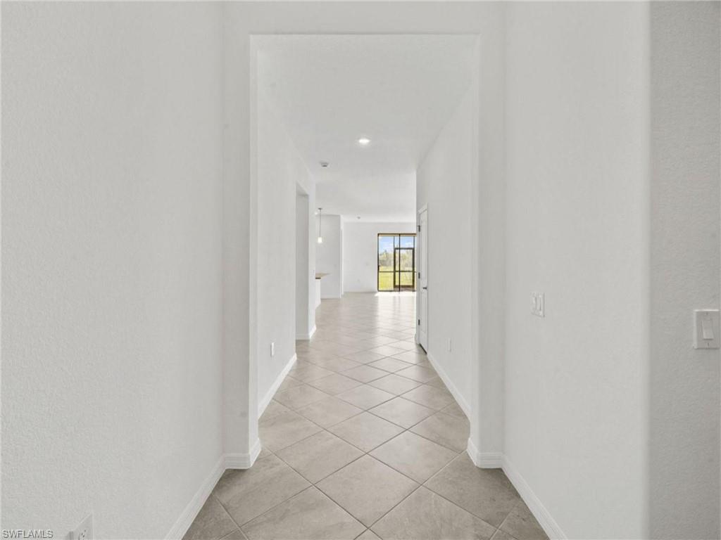 Bright entryway leading into the open-concept living area.