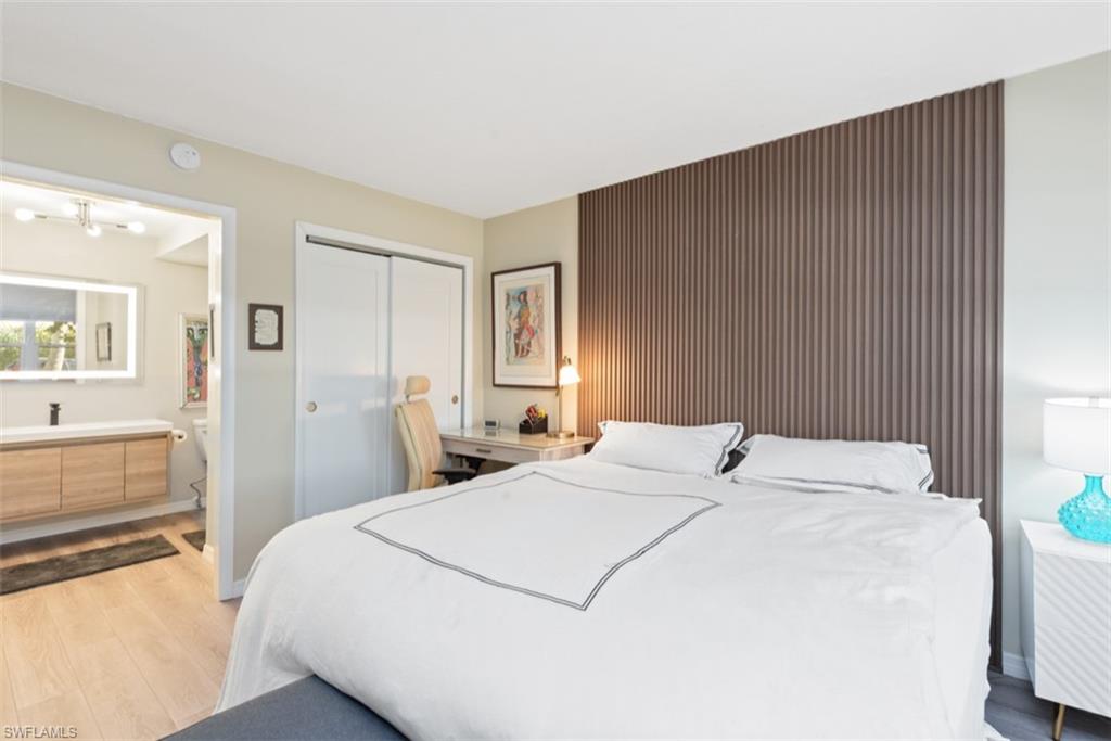 Bedroom featuring light hardwood / wood-style flooring and a closet