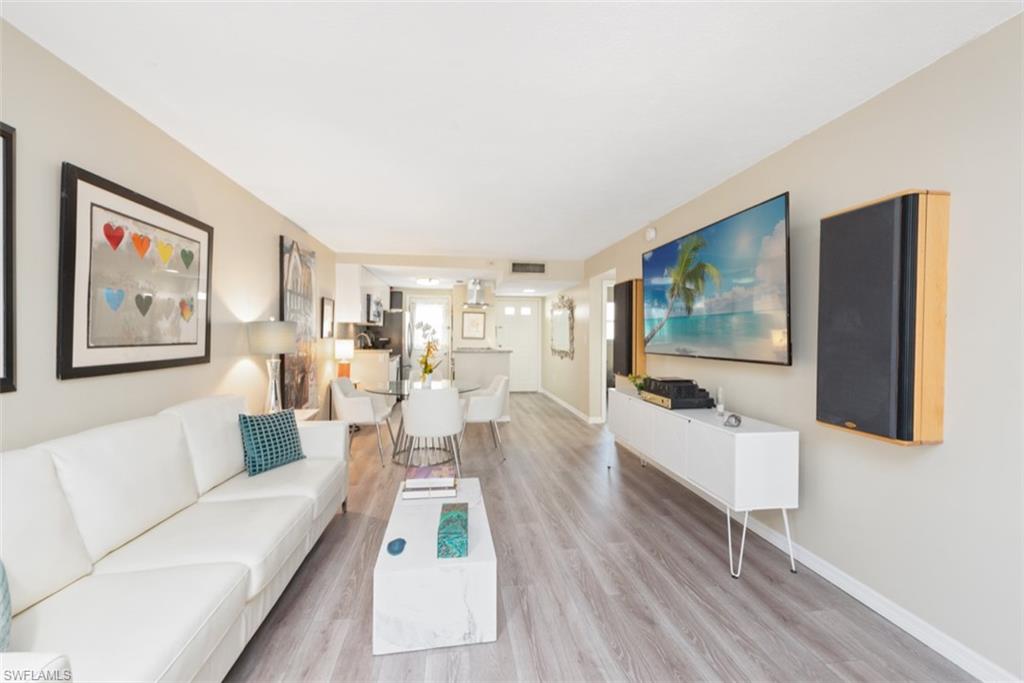Living room with hardwood / wood-style flooring