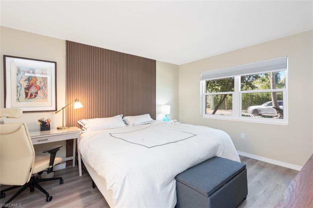 Bedroom featuring dark hardwood / wood-style floors