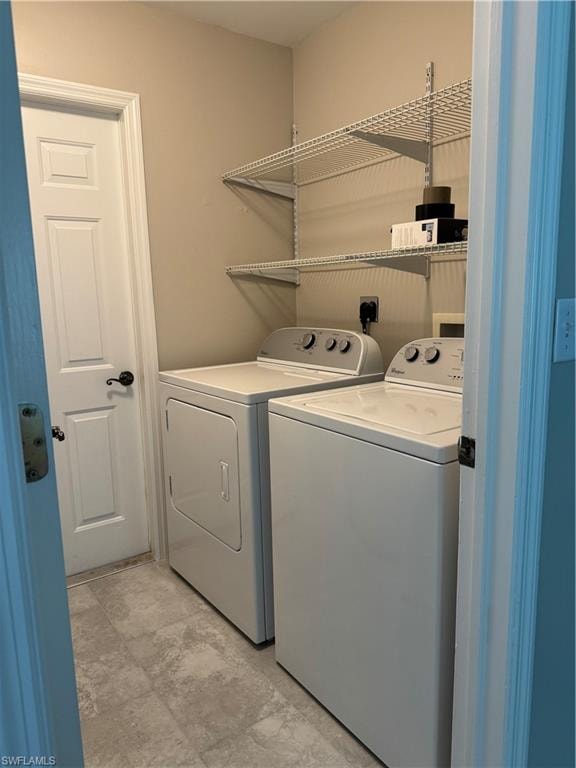 Laundry room with washing machine and clothes dryer inside the home.