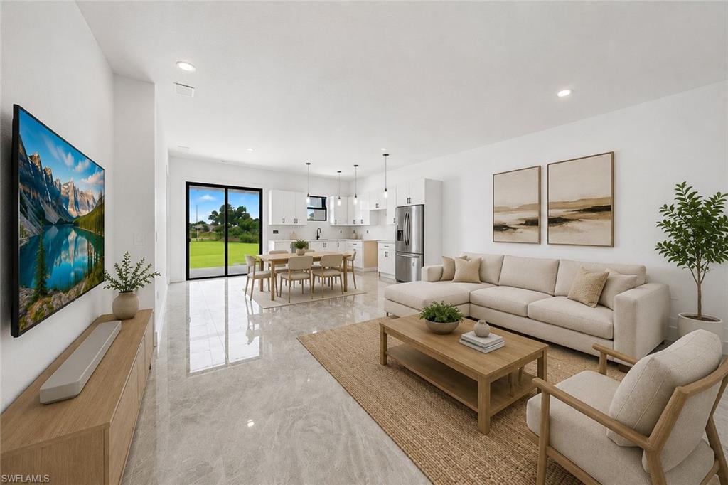 Virtually staged family room and kitchen with dining area.