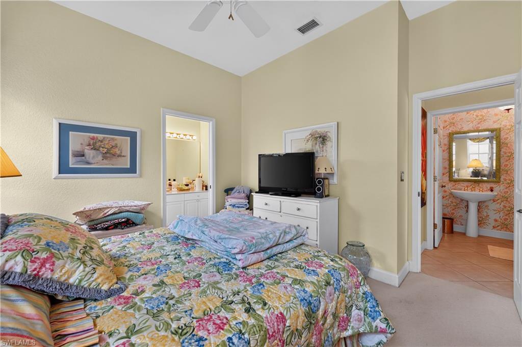 Bedroom featuring a vaulted ceiling and a ceiling fan
