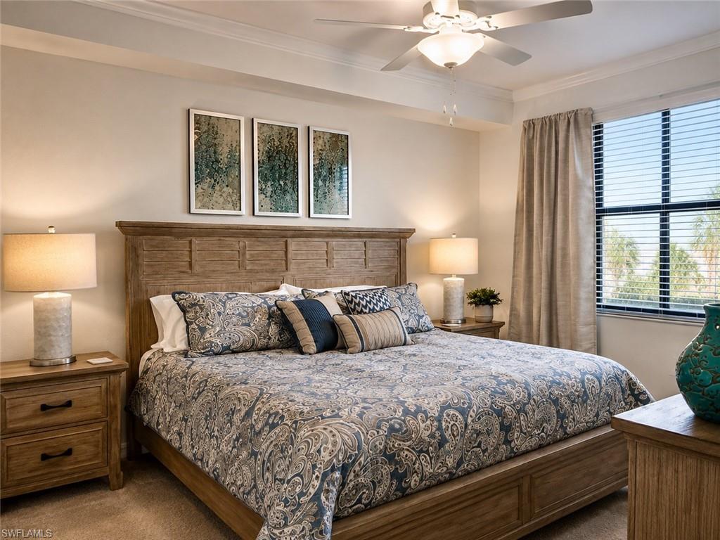 Crown molding accents the ceiling, complemented by a ceiling fan with integrated lighting