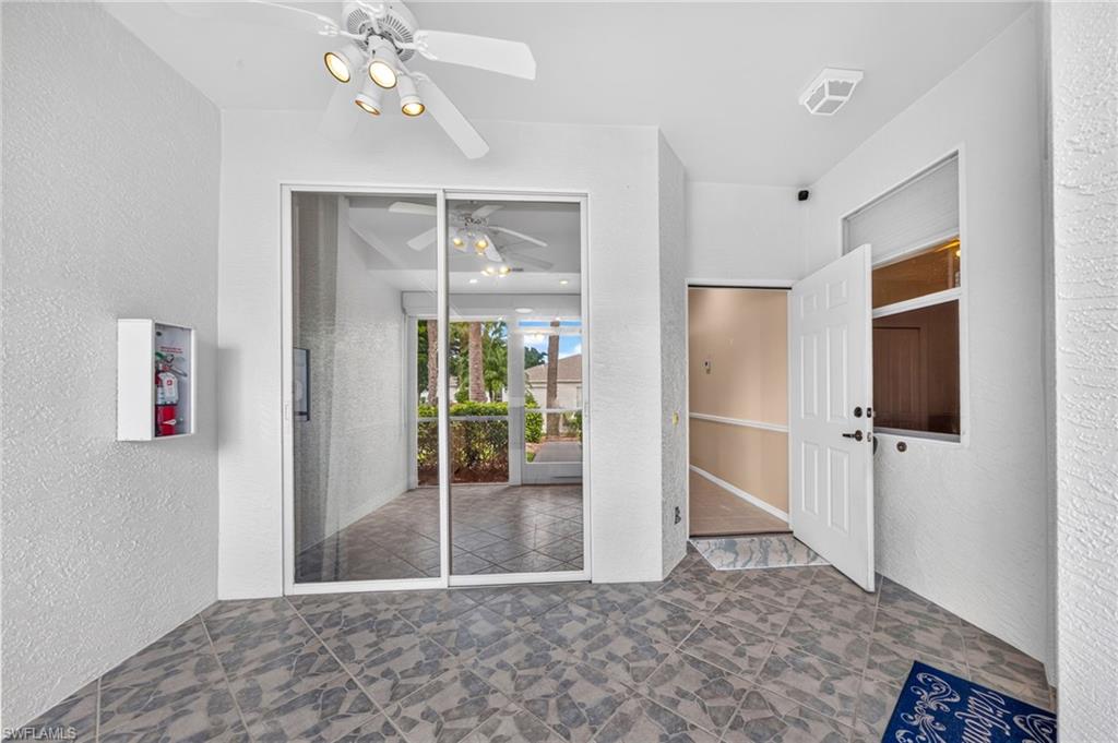 Front screened in Porch with access to your 1 car  garage and hurricane shutters