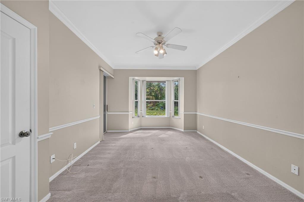 Primary Bedroom with slider leading out to enclosed lanai