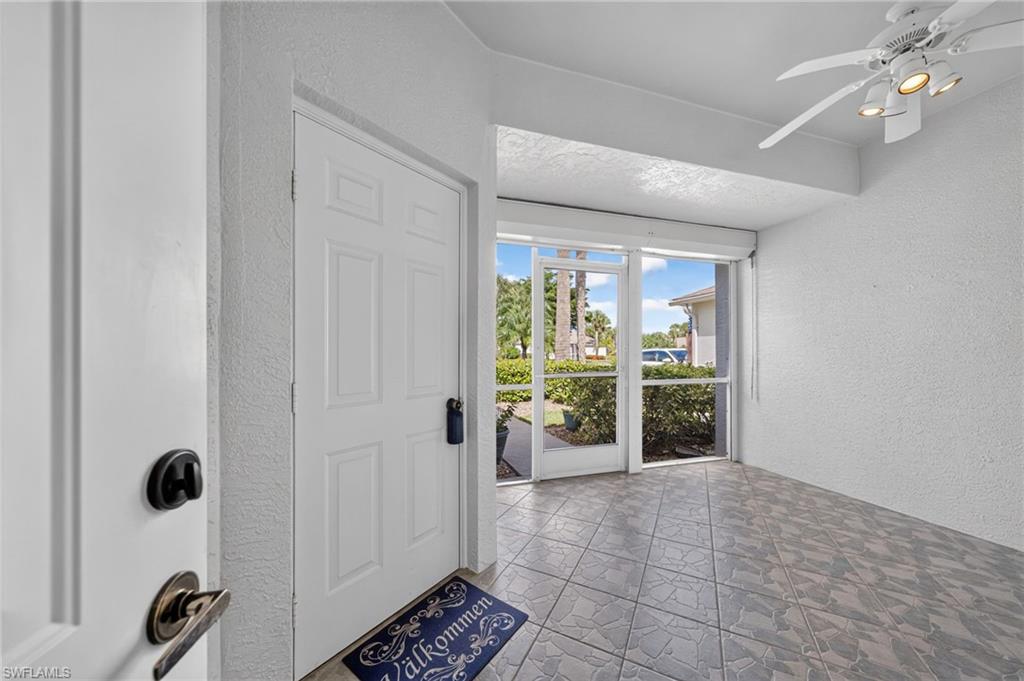 Screened front porch with hurricane shutters