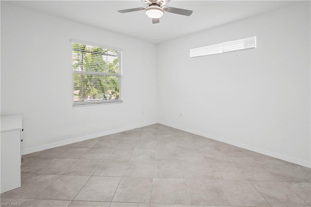 Master BedroomTile flooring, window with blinds, ceiling fan with integrated lighting