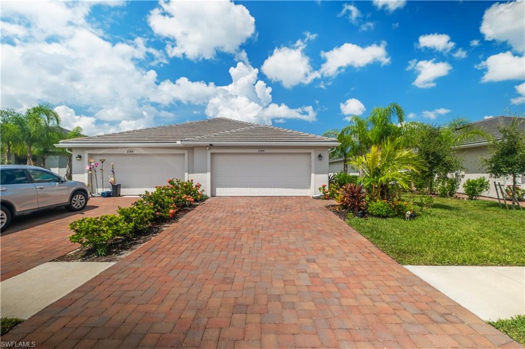 Dual garage entrances with paver driveways