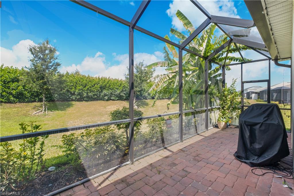 Extended Screened outdoor living area with brick pavers