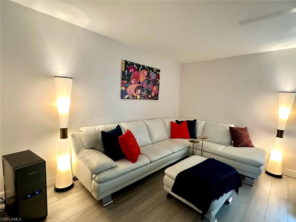 Light and bright Living room featuring luxury tile flooring
