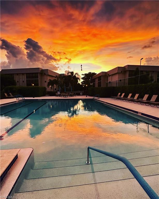 Huge Community pool with a sunset view