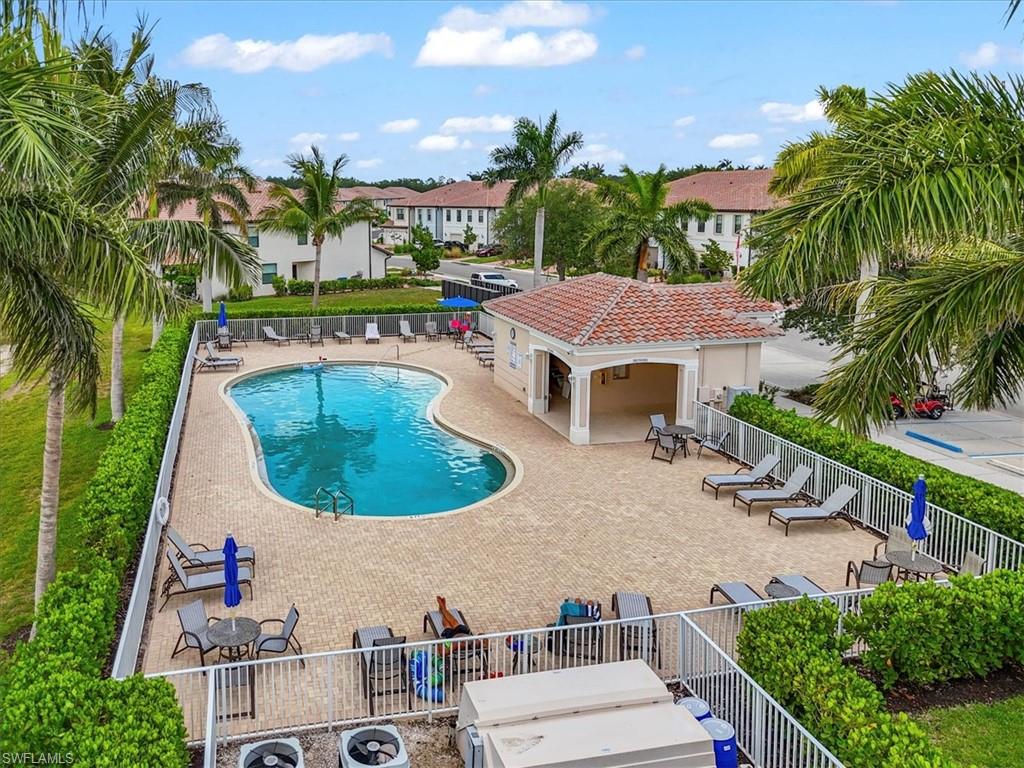Community pool featuring a patio