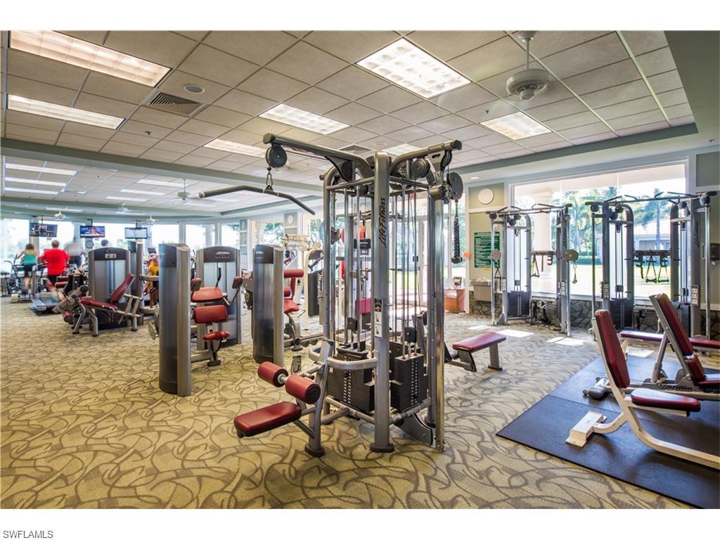 Workout area featuring carpet floors, visible vents, and a paneled ceiling