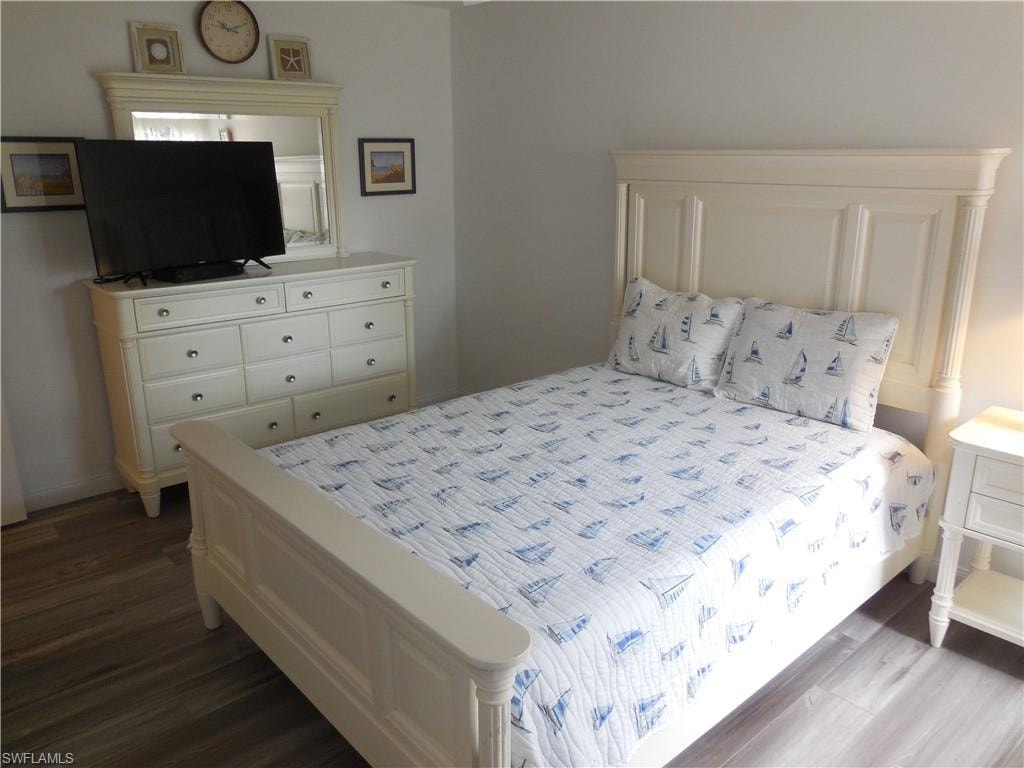 Bedroom featuring dark wood-style floors
