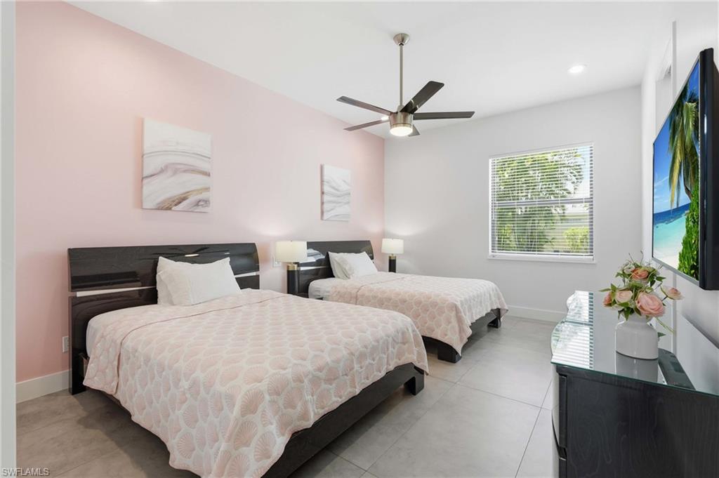 Guest bedroom with two queen beds and ensuite bathroom