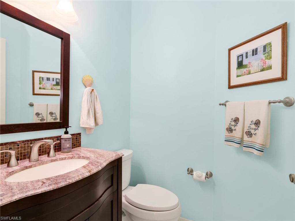 Vanity with an integrated sink and stone countertop