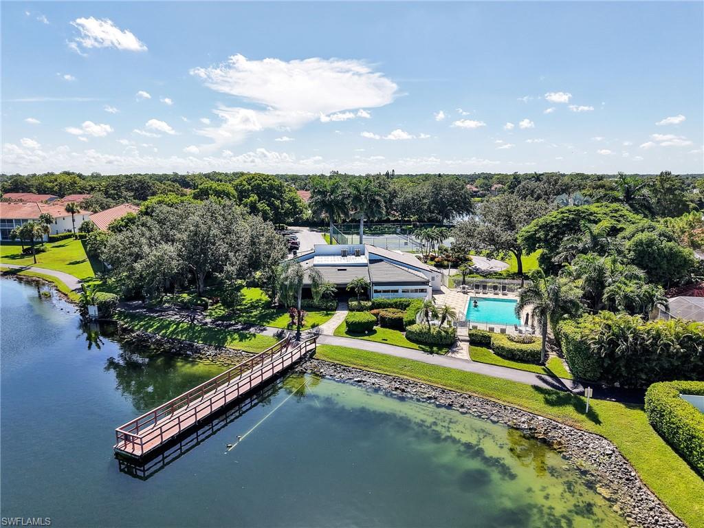 Community amenities featuring a swimming pool, tennis courts, and a waterfront dock