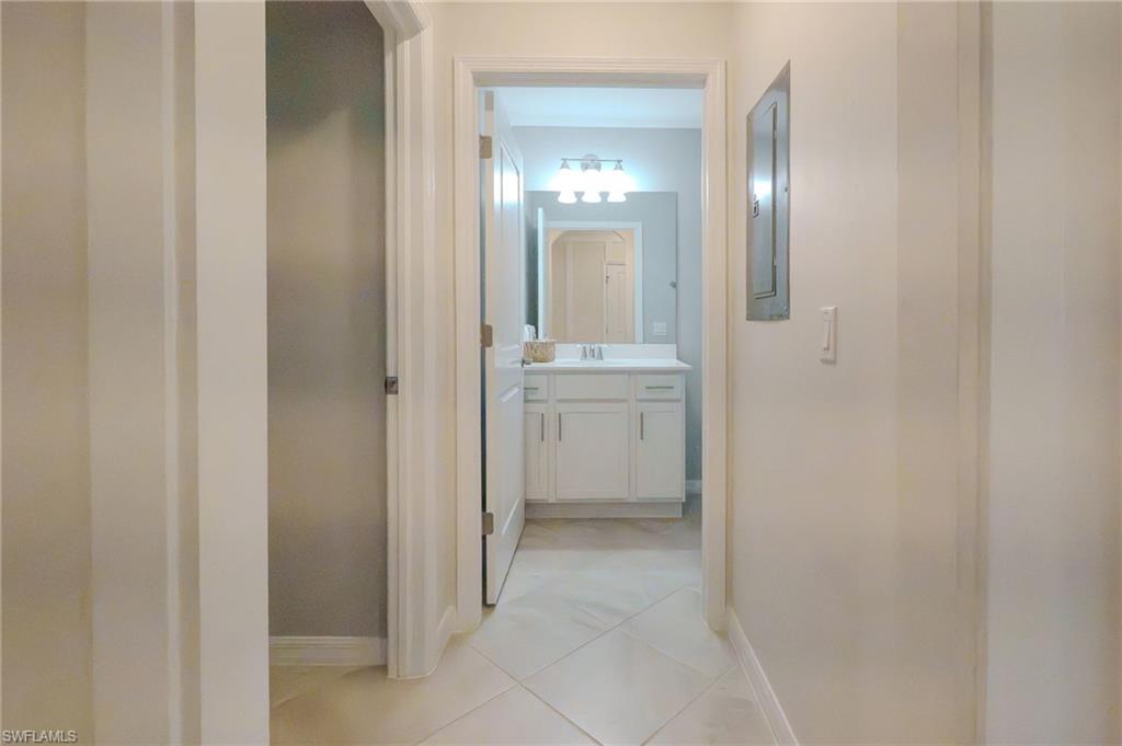 Hallway featuring diagonal tile flooring