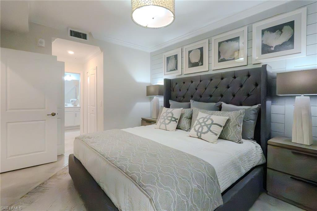 Recessed lighting accents the crown molding