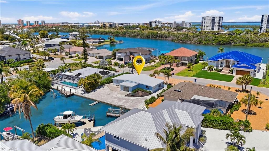 The property includes a private dock, providing direct water access - Virtually Edited Image