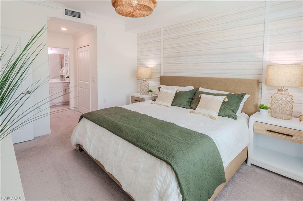 Recessed lighting, crown molding, and textured accent wall