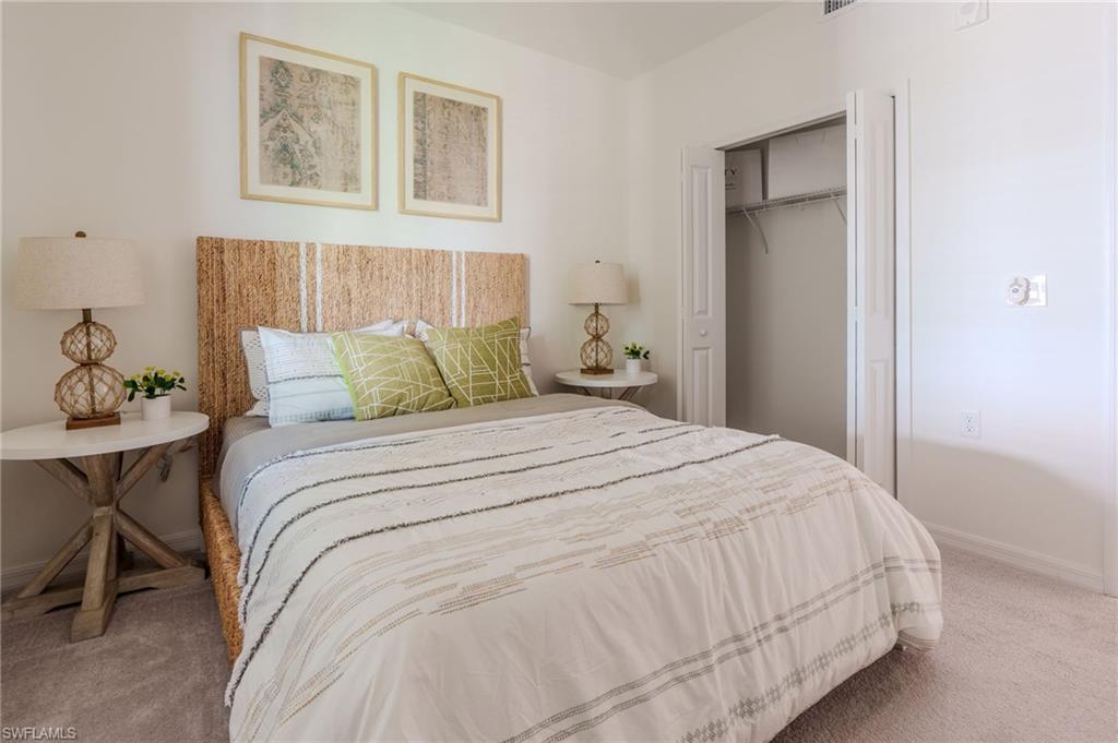 Plush carpeting, bi-fold closet doors, and light-toned wall paint