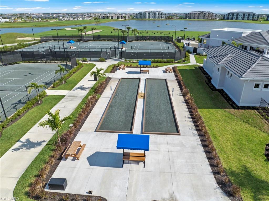 Tennis courts, bocce ball courts, and manicured green spaces