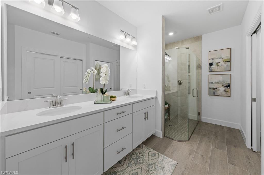 Dual vanity with undermount sinks and white countertops