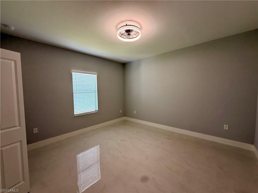 Recessed lighting, light-toned walls, and neutral flooring