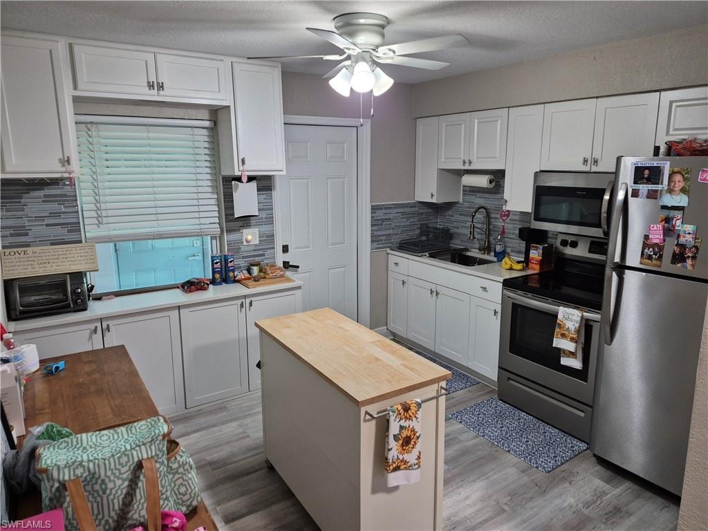 Right unit kitchenWhite cabinets stainless steel appliances