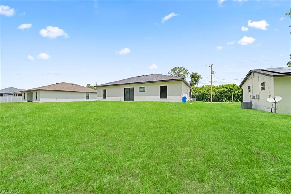 Expansive green space featuring a level grade and partial fencing