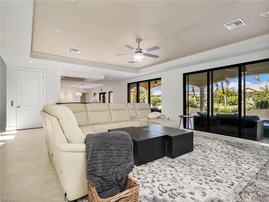 Tray ceiling with recessed lighting and a ceiling fan