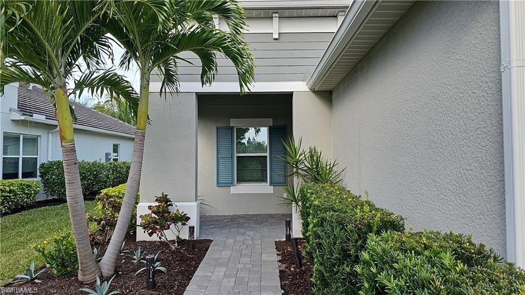 Textured stucco exterior with horizontal siding accents