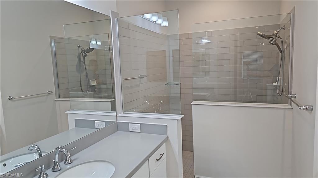 Dual vanity with under-mount sinks and chrome fixtures