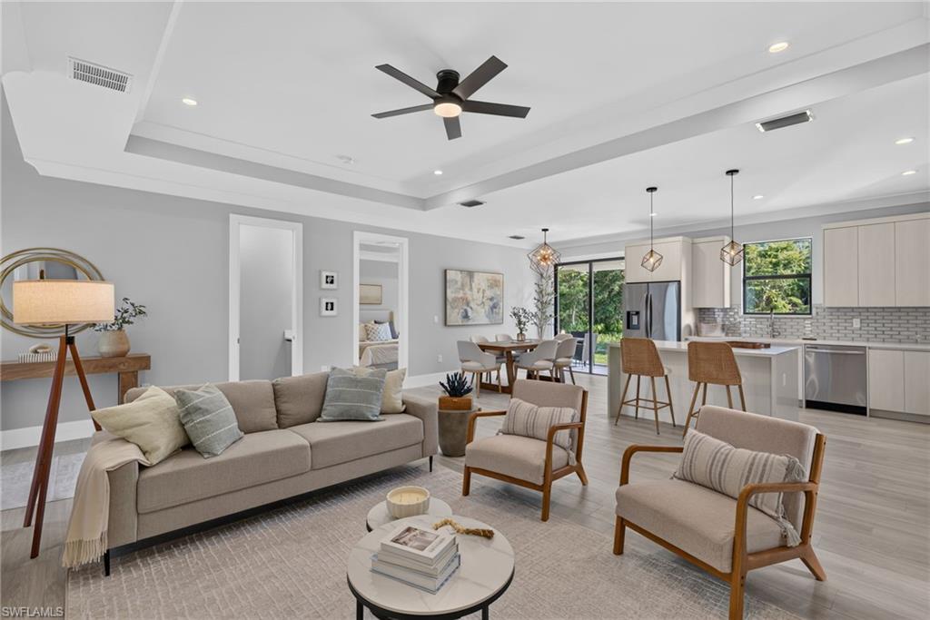 Tray ceiling with recessed lighting and a ceiling fan