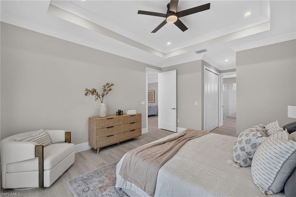 Tray ceiling with recessed lighting and a ceiling fan