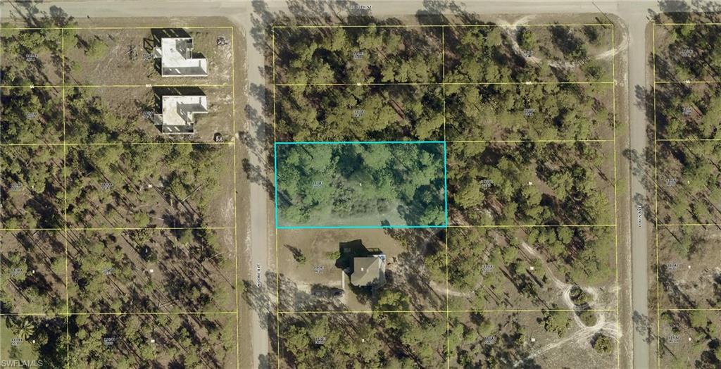 Aerial map of property and surrounding area featuring property parcel outlined