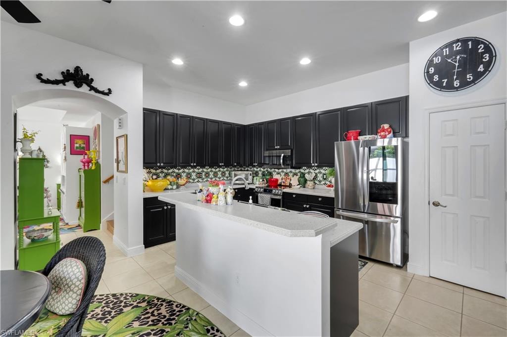 Full bank of Cabinetry and counter space and a pantry