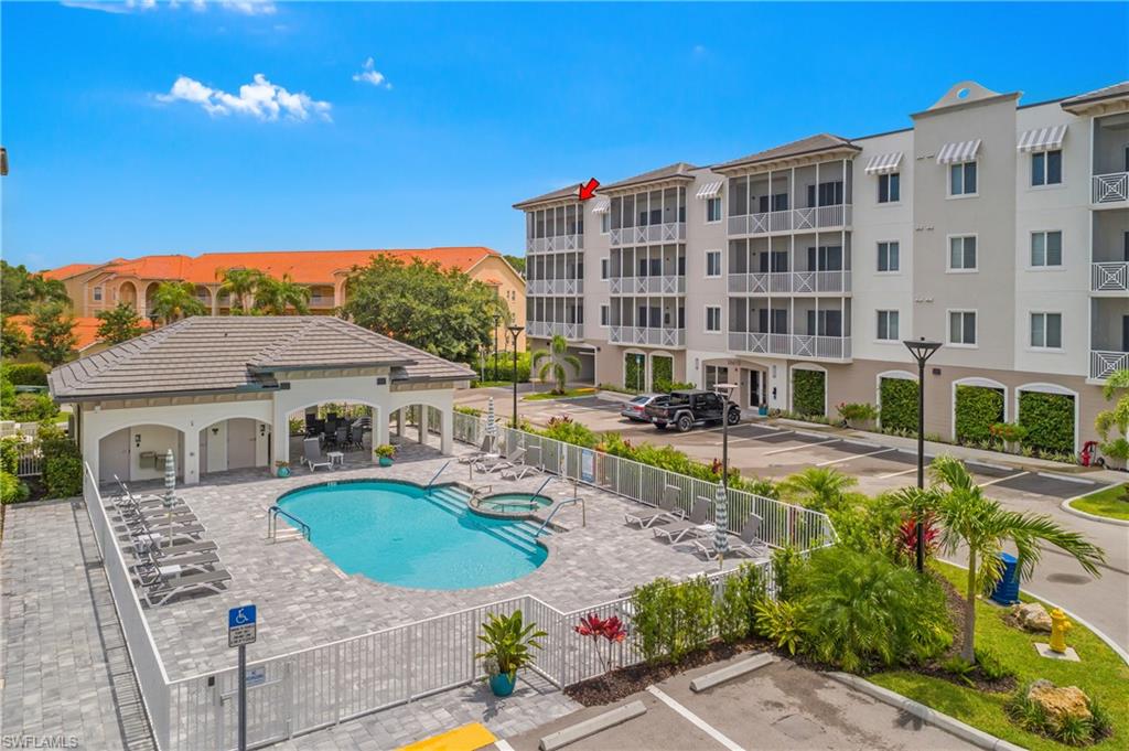 Resort-style pool with integrated spa and surrounding paver deck