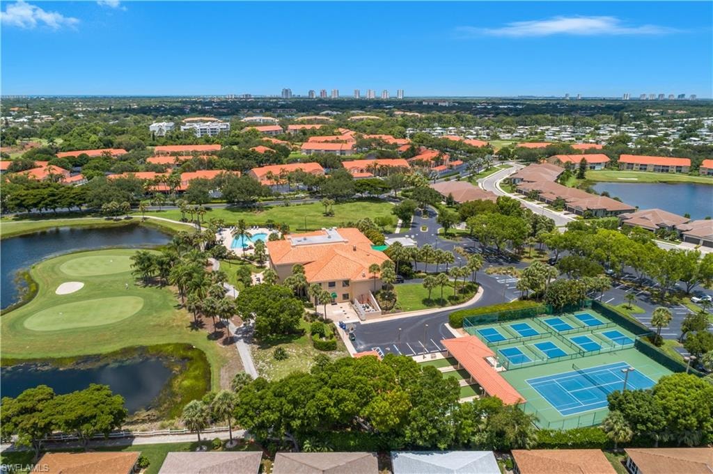 Expansive community featuring a clubhouse, swimming pool, multiple tennis courts, and a golf course