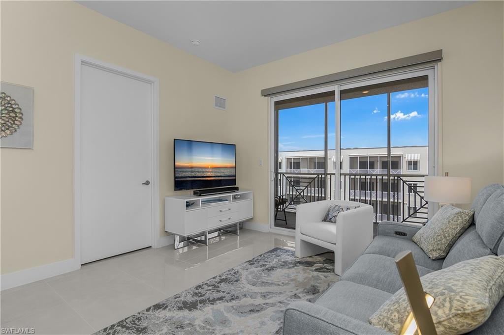 Sliding glass doors to outdoor area, tile flooring, and neutral wall color