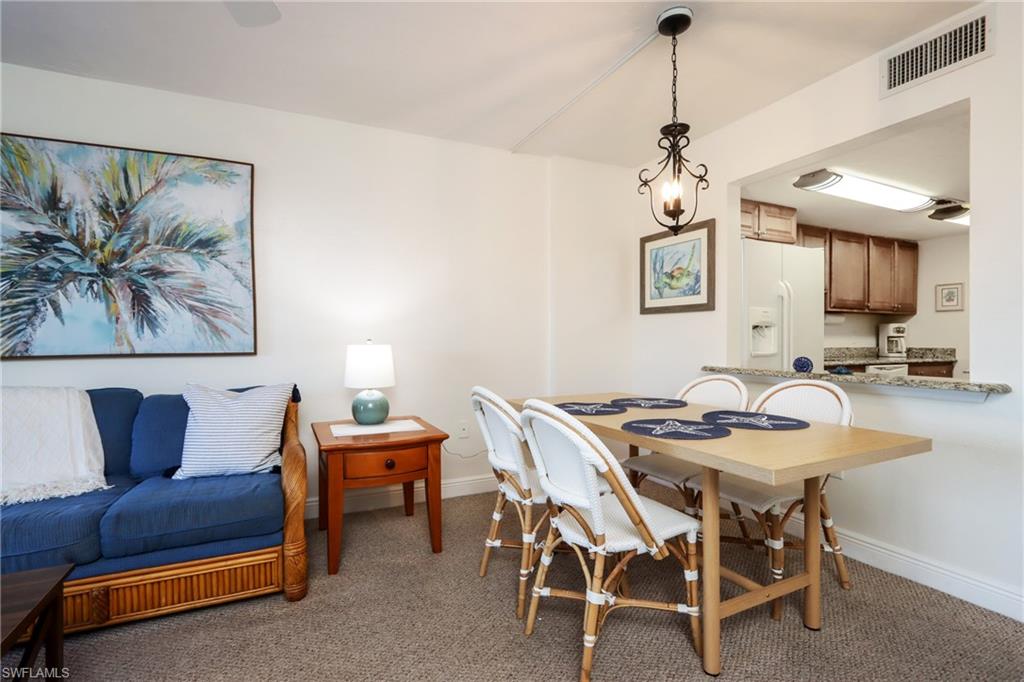 Dining area with carpet flooring and baseboards