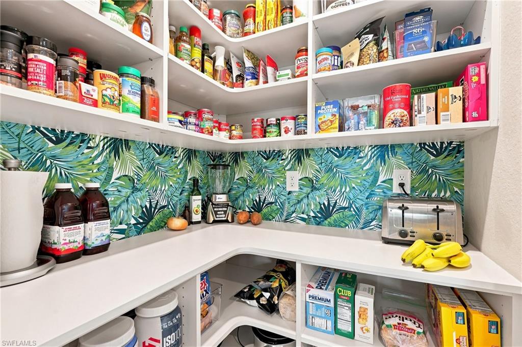 Custom pantry shelving with outlet for convenience