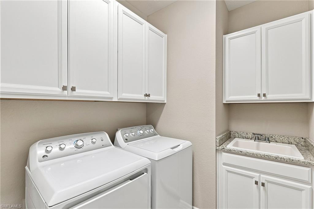 Upgraded with extra cabinetry and utility tubb