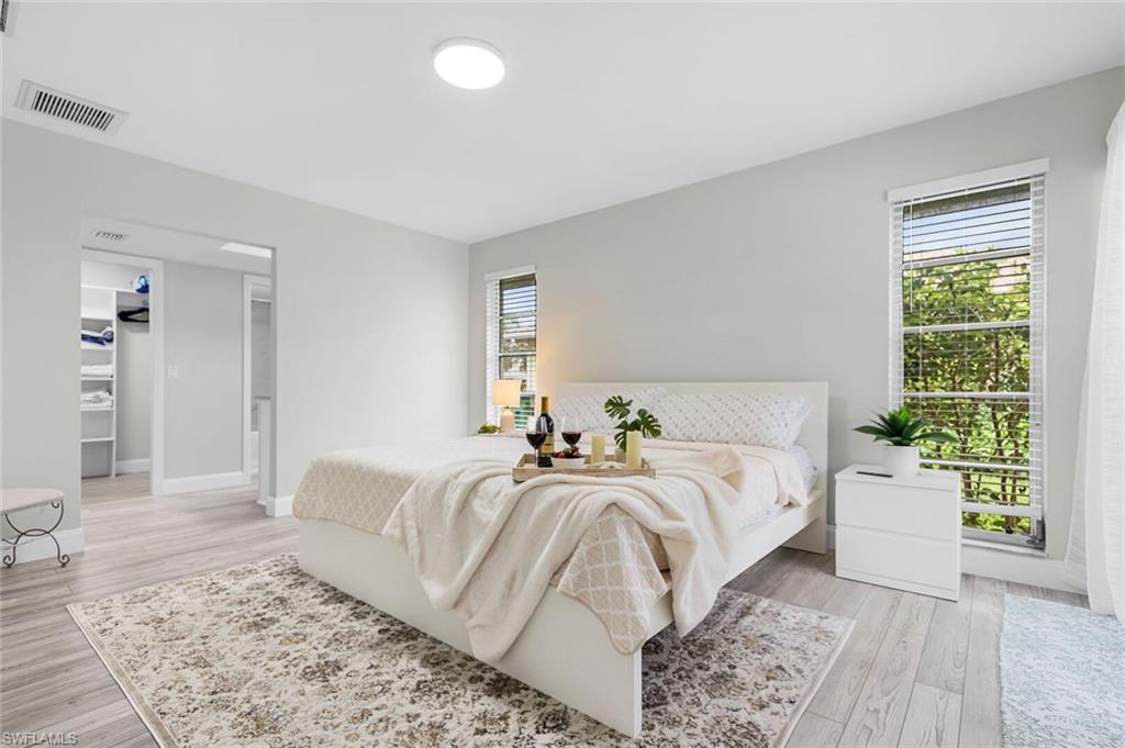 Built-in white shelving, integrated hanging rod, and painted walls