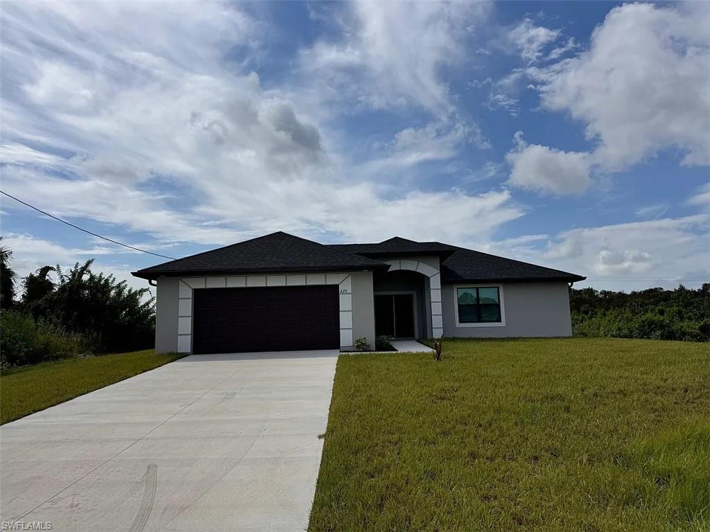 Single-story stucco exterior with a dark shingle roof