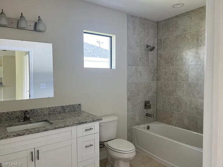 Spa-inspired bathroom featuring a white vanity with dual sinks, granite-style countertop, and polished chrome fixtures
