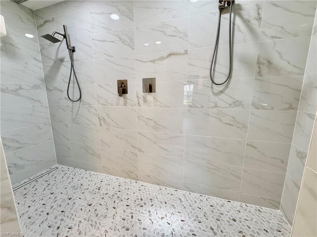 Oversized shower with multiple heads.