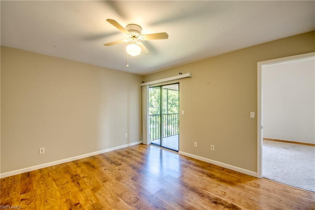 Spare room featuring light wood-type flooring and ceiling fan